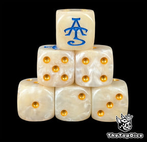 White and beige resin D6 dice with a gold and blue sigil and gold pips