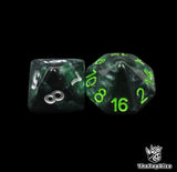 Close up of a black and green D8 and D16 with silver numbers for scatter and long range rolls