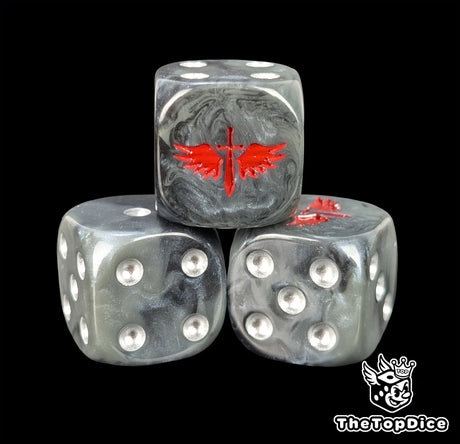 Close-up of a black D6 die with a red winged sword