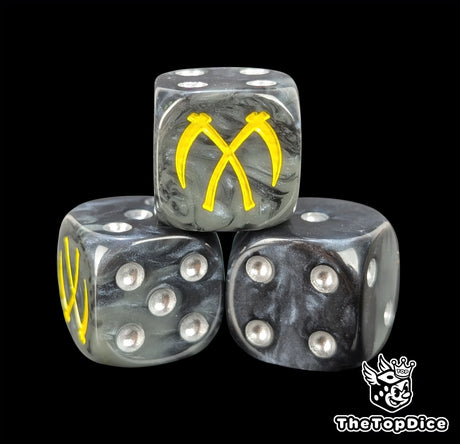 Close-up of a black D6 die with two crossed yellow scythes