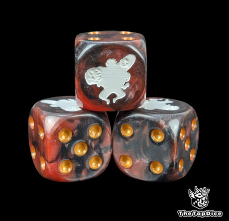 Close up of a red and black 16mm resin D6 die engraved with a white fighter and gold pips