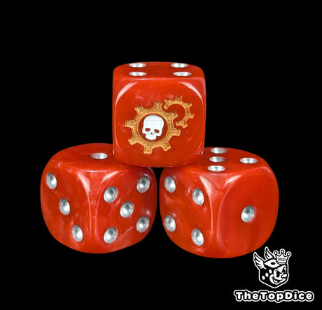 Close up of a red 16mm resin D6 die engraved with a white skull in gold gears and silver pips