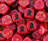 Pile of red Red Corsairs dice with gold pips and black chaos fists