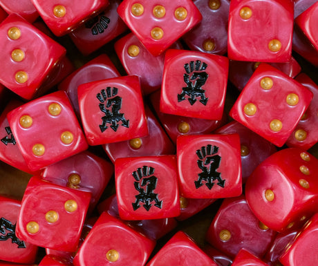 Pile of red Red Corsairs dice with gold pips and black chaos fists