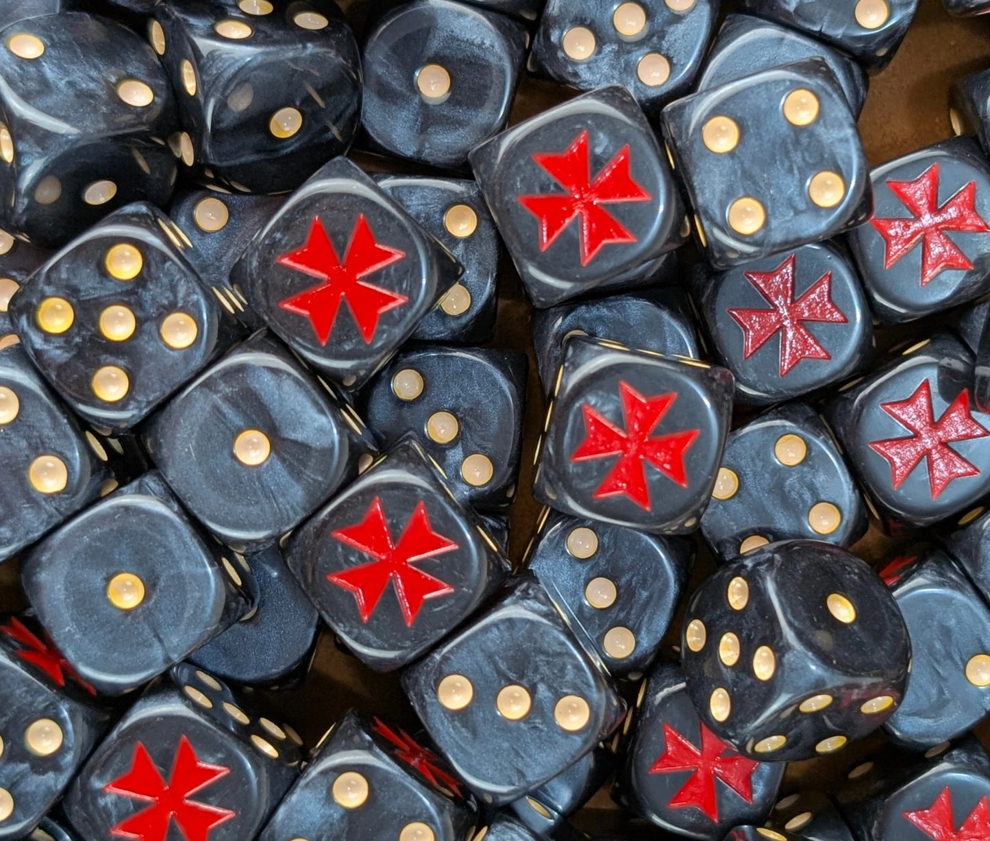 Pile of black red cross 16mm D6 dice for a sci-fi crusader army