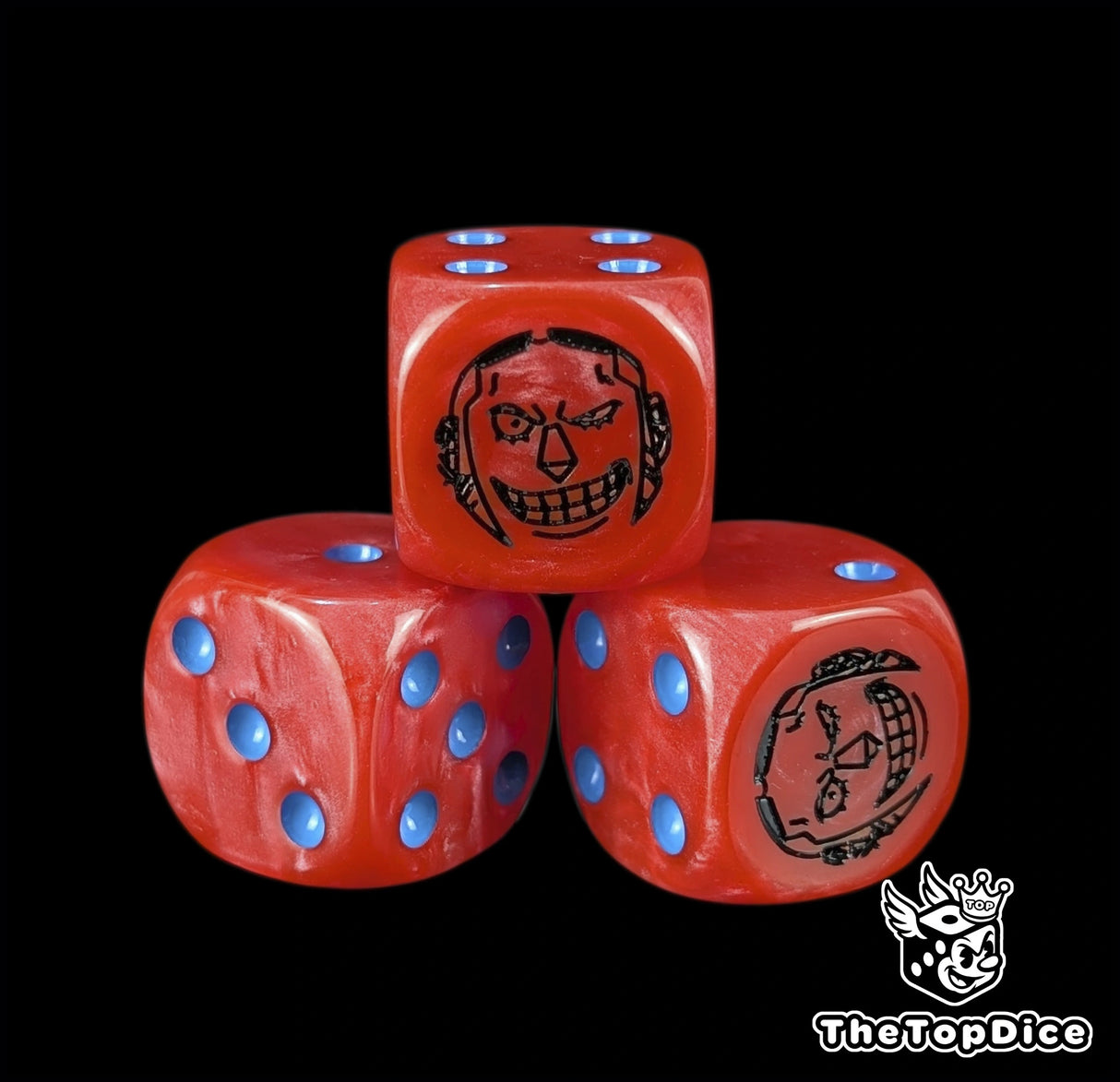 Close up of a red 16mm resin D6 die engraved with a black cyborg emblem and blue pips