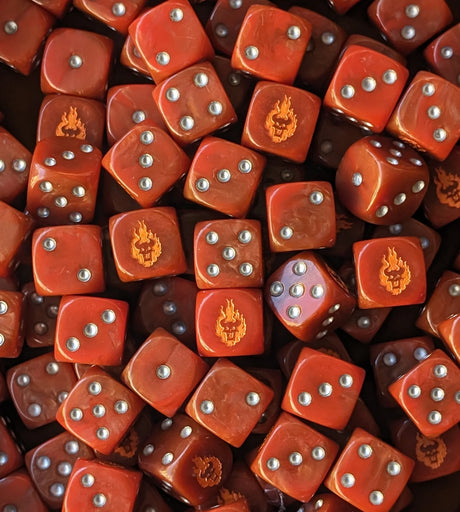 Pile of red 16mm D6 dice with orange demon faces for a sci-fi chaos army