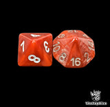 Close up of a red D8 and D16 with white numbers for scatter and long range rolls