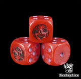 Close up of a red 16mm resin D6 die engraved with a black warrior emblem and purple pips