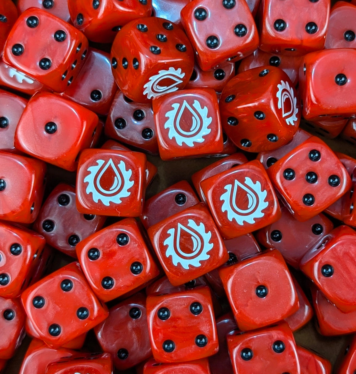 Pile of red saw drop 16mm D6 dice for a sci-fi marine army
