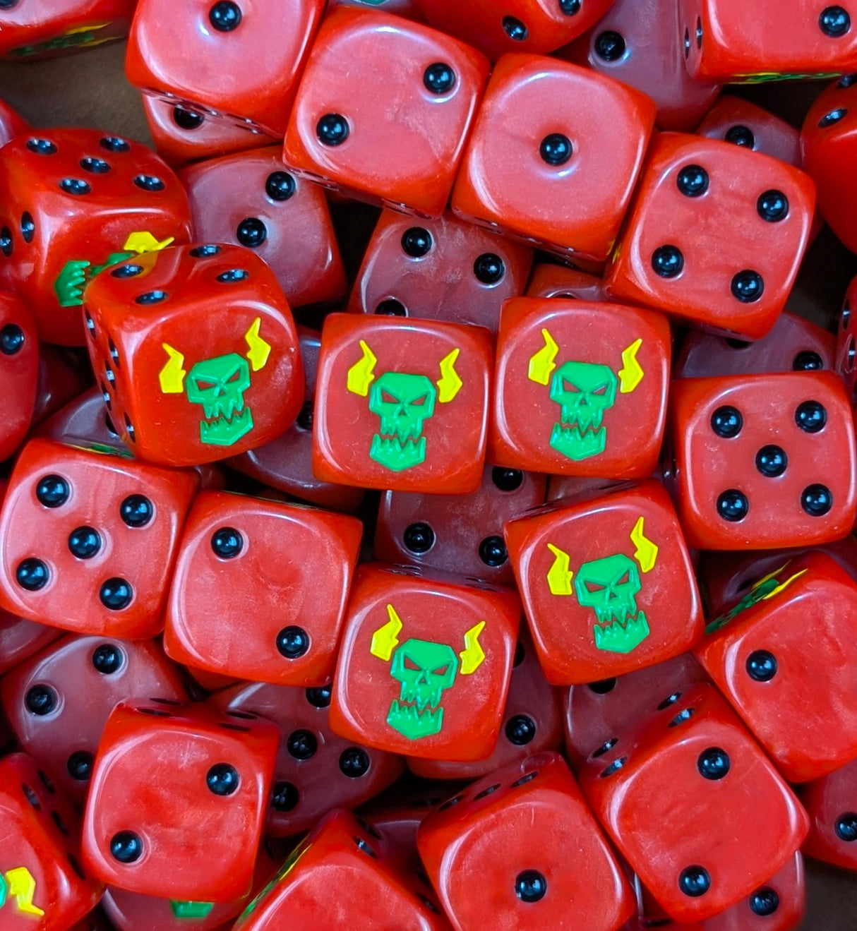 Pile of red speed ork 16mm D6 dice for a sci-fi orc warband