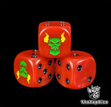Close up of a red 16mm resin D6 die engraved with a green ork face and yellow lightning and black pips