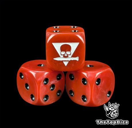 Close up of a red 16mm resin D6 die engraved with a white squad sigil and black pips