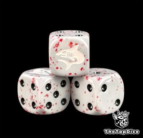 Three grey space shark dice with red spatter and black pips
