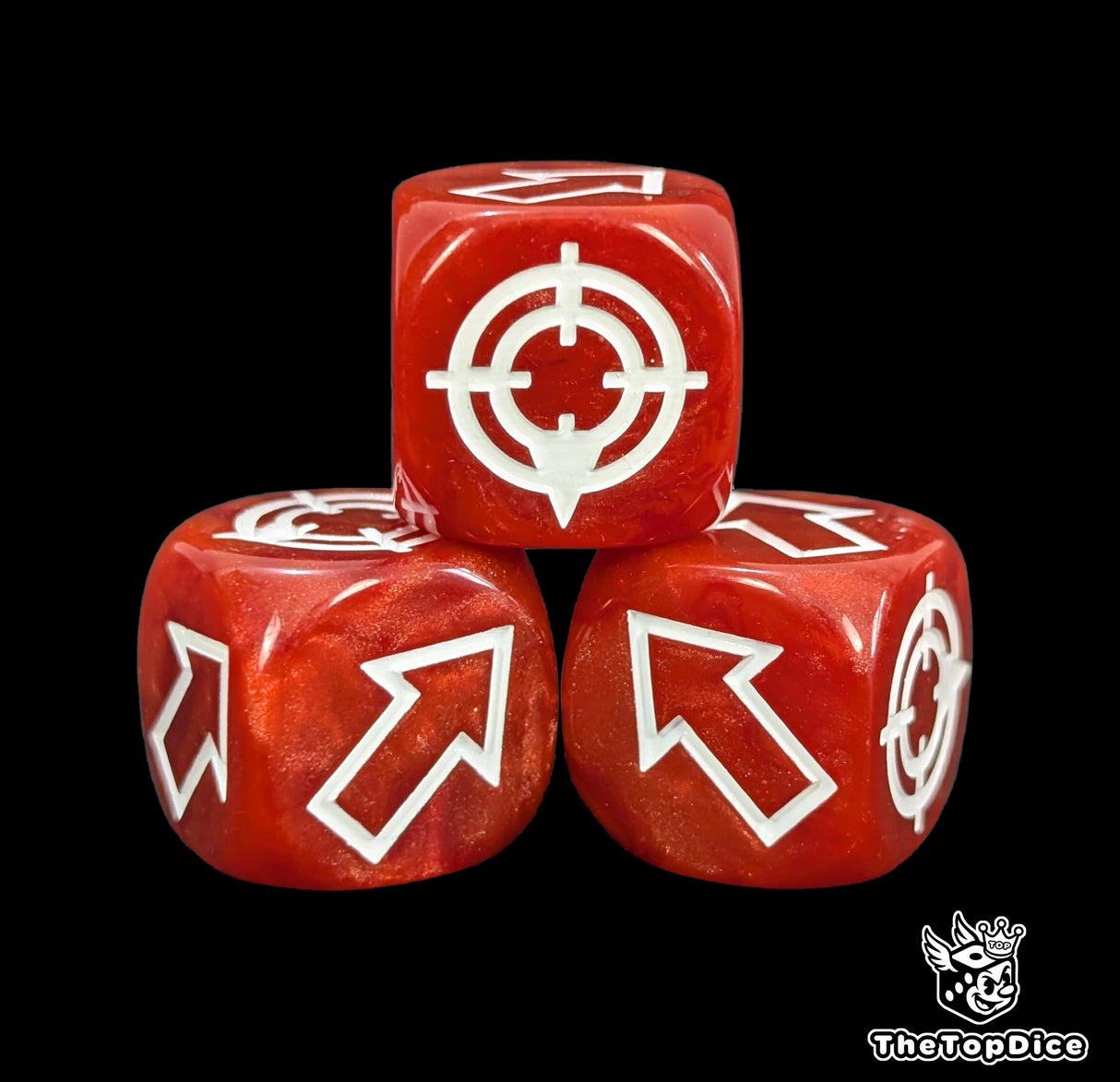 Close up of a red resin scatter die showing the white direction arrows