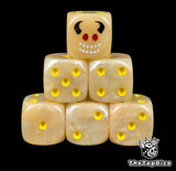 Flesh toned 16mm D6 dice with a horned imp face and yellow pips for fantasy wargaming