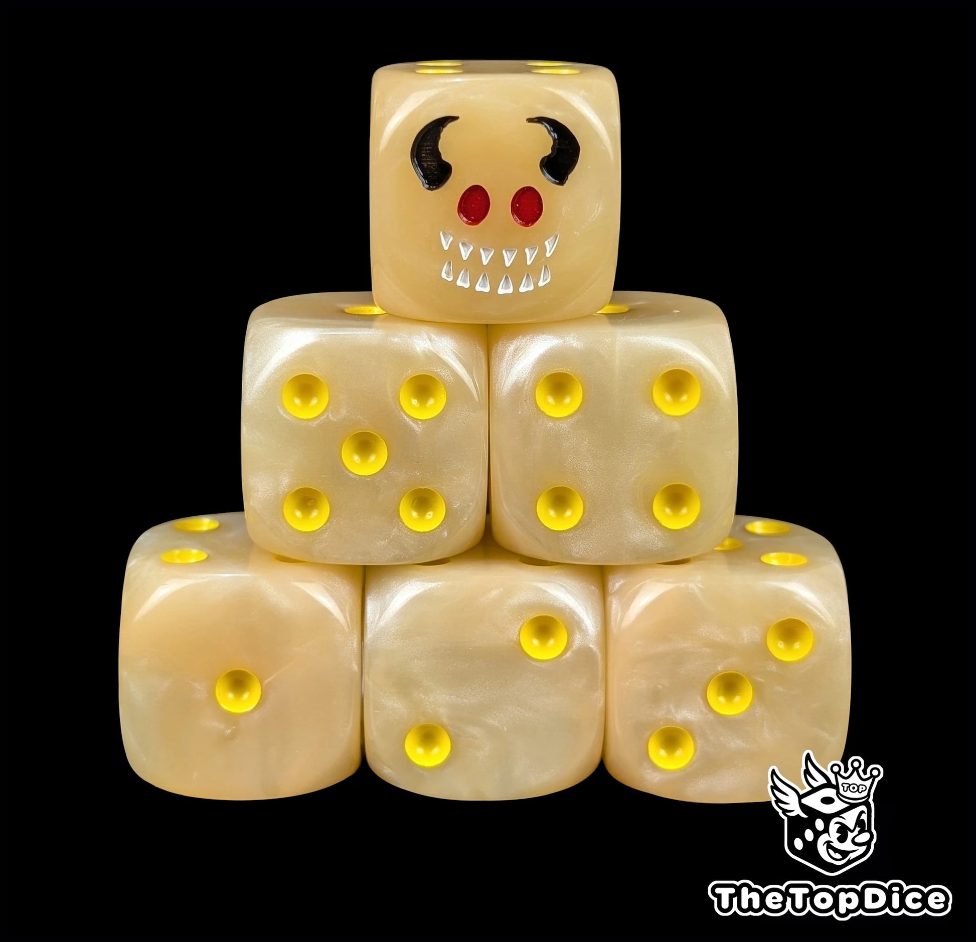 Flesh toned 16mm D6 dice with a horned imp face and yellow pips for fantasy wargaming