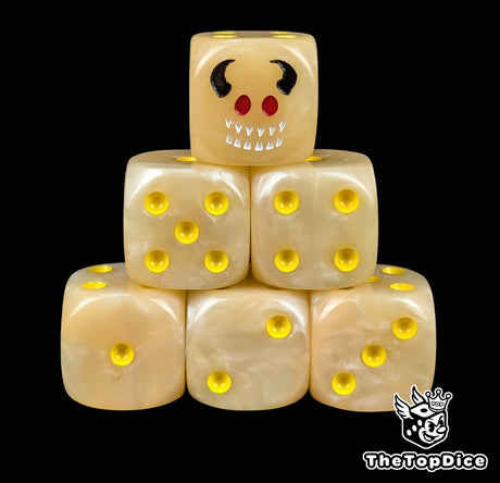 Flesh toned 16mm D6 dice with a horned imp face and yellow pips for fantasy wargaming