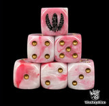 Close up of two pink D6 with a black three feather logo on the six face for fantasy football
