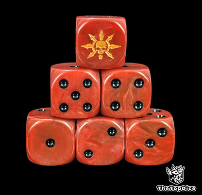 Red 16mm D6 dice with a gold chaos star and skull emblem and black pips for fantasy wargaming