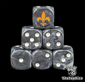 Black resin D6 dice with a gold lily emblem and white pips