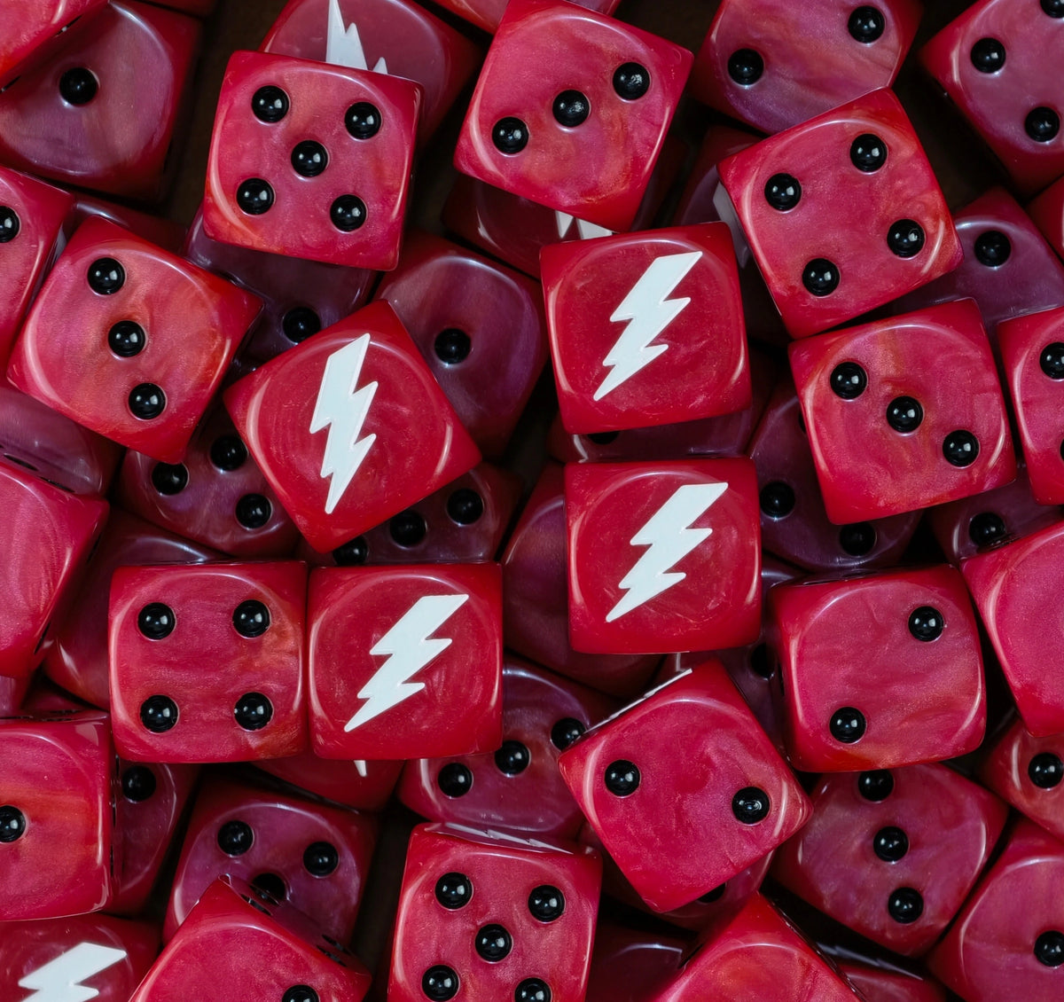 Pile of red White Scars dice with black pips and white lightning bolts