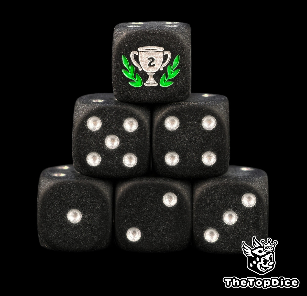Second place trophy dice, matte black 16mm D6 with silver pips and a silver runner up cup in a green laurel, a tournament prize for board games and game nights