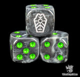 Close up of a black 16mm resin D6 die engraved with a coffin shaped tomb rune and green pips