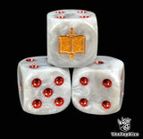 Close up of a grey 16mm resin D6 die engraved with a gold sword piercing a book and red pips