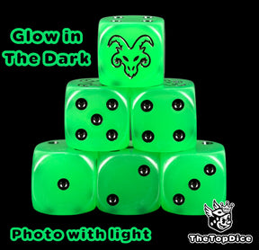 Skaven Age of Sigmar dice, translucent green glow in the dark 16mm resin D6 with black pips and a horned rat face, photographed with the lights on