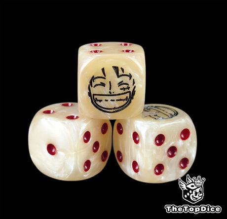 Close up of a beige 16mm resin D6 die engraved with a black smiling captain emblem and red pips