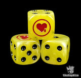 Close-up of three yellow 16mm grimdark D6 dice engraved with a red heart emblem