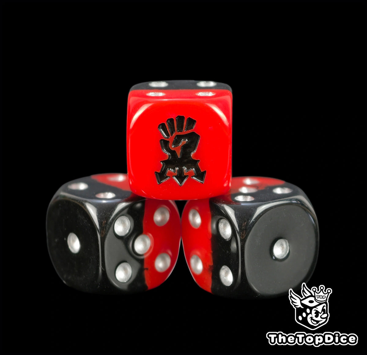 Three two tone red and black chaos dice with a black corsair icon