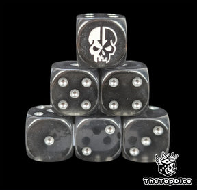 Black resin D6 dice with a split skull emblem and silver pips