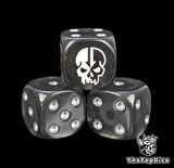 Close-up of a black D6 die with a half pale half shadow skull