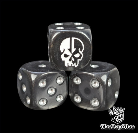 Close-up of a black D6 die with a half pale half shadow skull