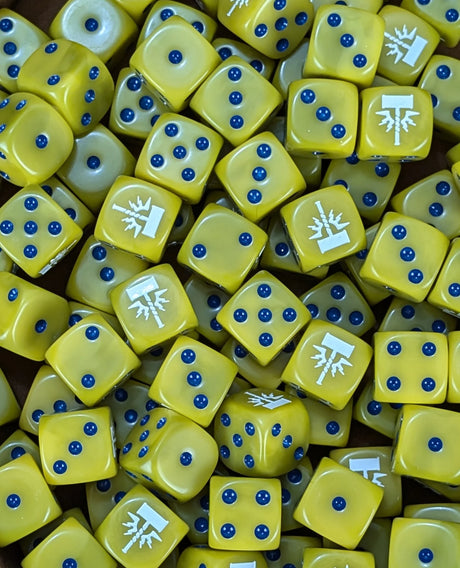 Pile of yellow storm hammer 16mm D6 dice for a fantasy celestial army