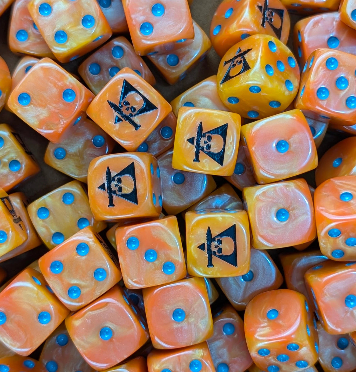 Pile of orange skull squad 16mm D6 dice for a sci-fi skirmish team