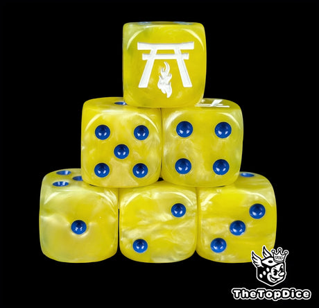 Yellow resin D6 dice with a white temple and flame and blue pips