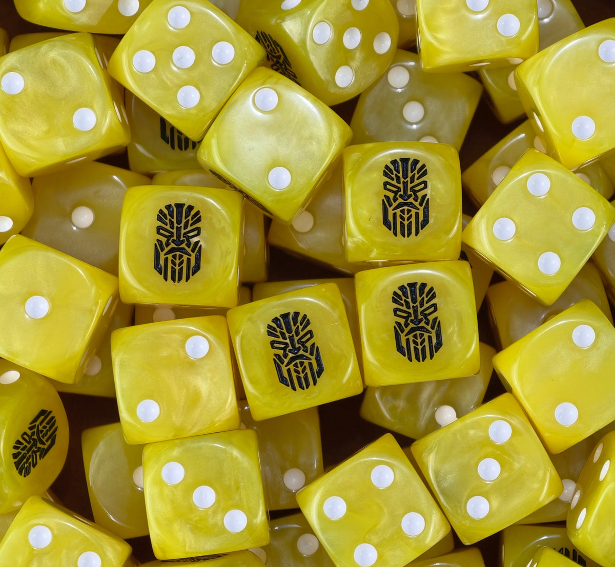 A pile of yellow Votann D6 with white pips and black kin runes