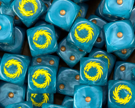 A pile of teal Thousand Sons dice, yellow dragons and gold pips repeating