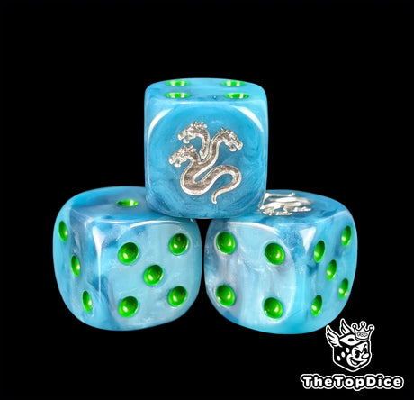 Close up of a teal 16mm resin D6 die engraved with a silver three headed hydra and green pips