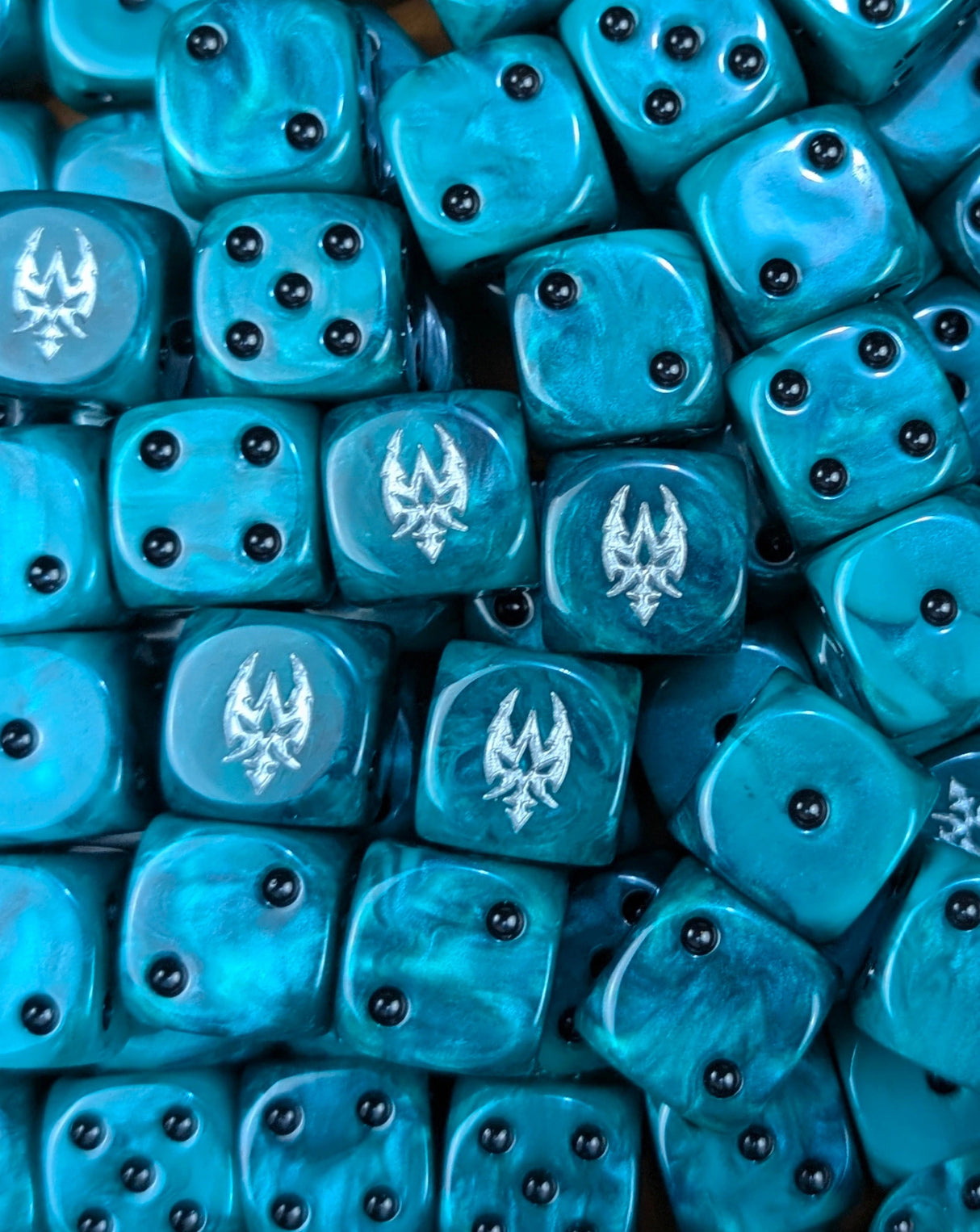 Pile of teal raider sigil 16mm D6 dice for a sci-fi dark elf army