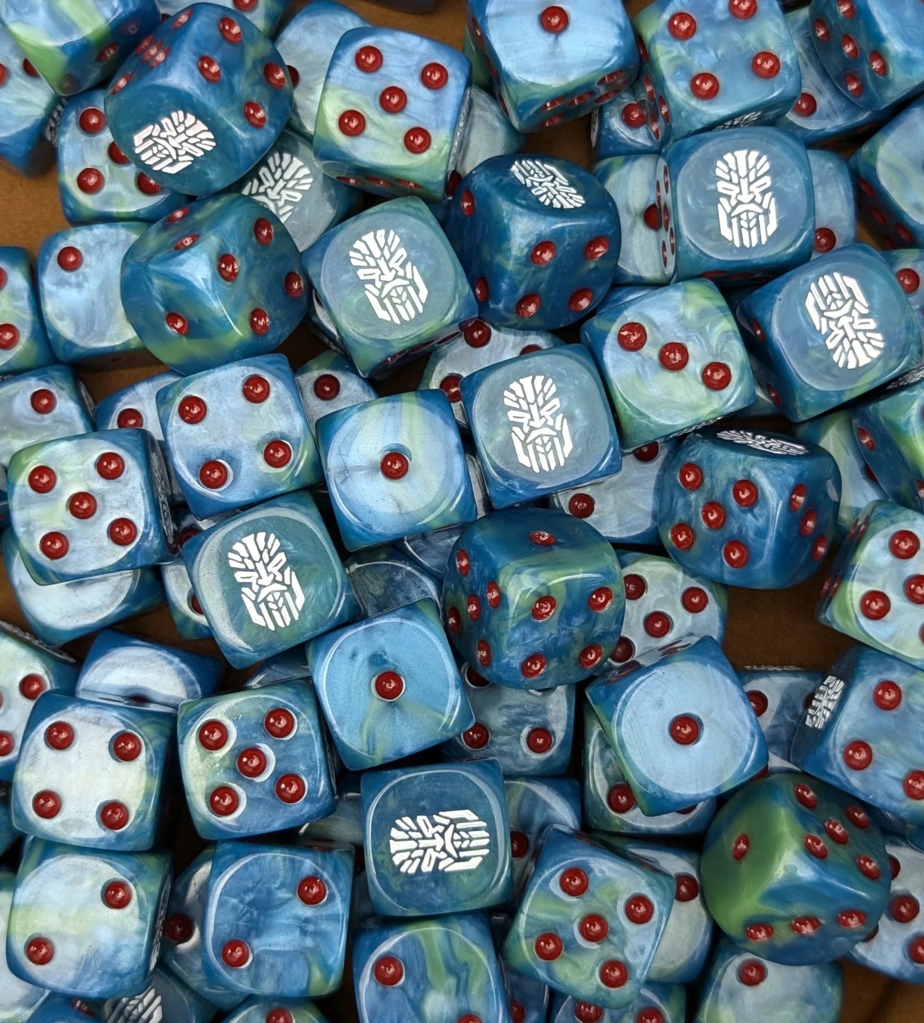 Pile of teal tech dwarf 16mm D6 dice for a sci-fi dwarf army