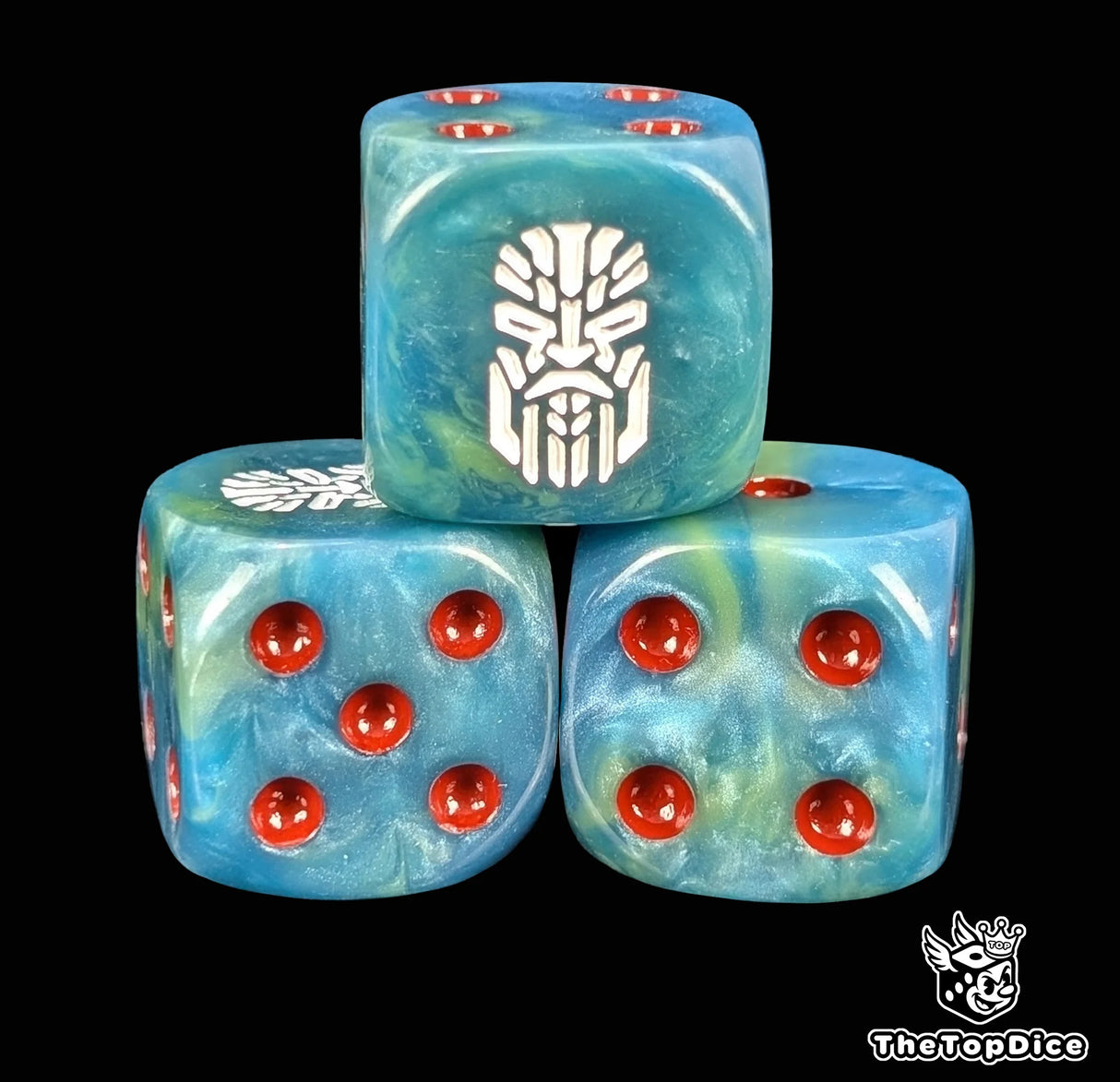 Close up of a teal 16mm resin D6 die engraved with a white rune and a stern face and red pips