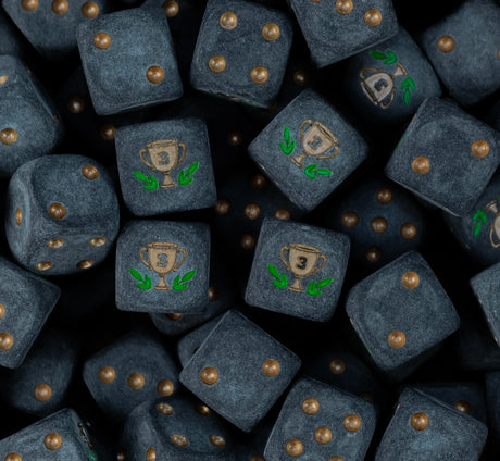 Pile of matte black third place trophy dice with bronze pips and bronze number three cups in a green laurel