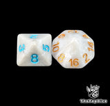 Close up of a bone white D8 and D16 with gold numbers for scatter and long range fantasy football rolls