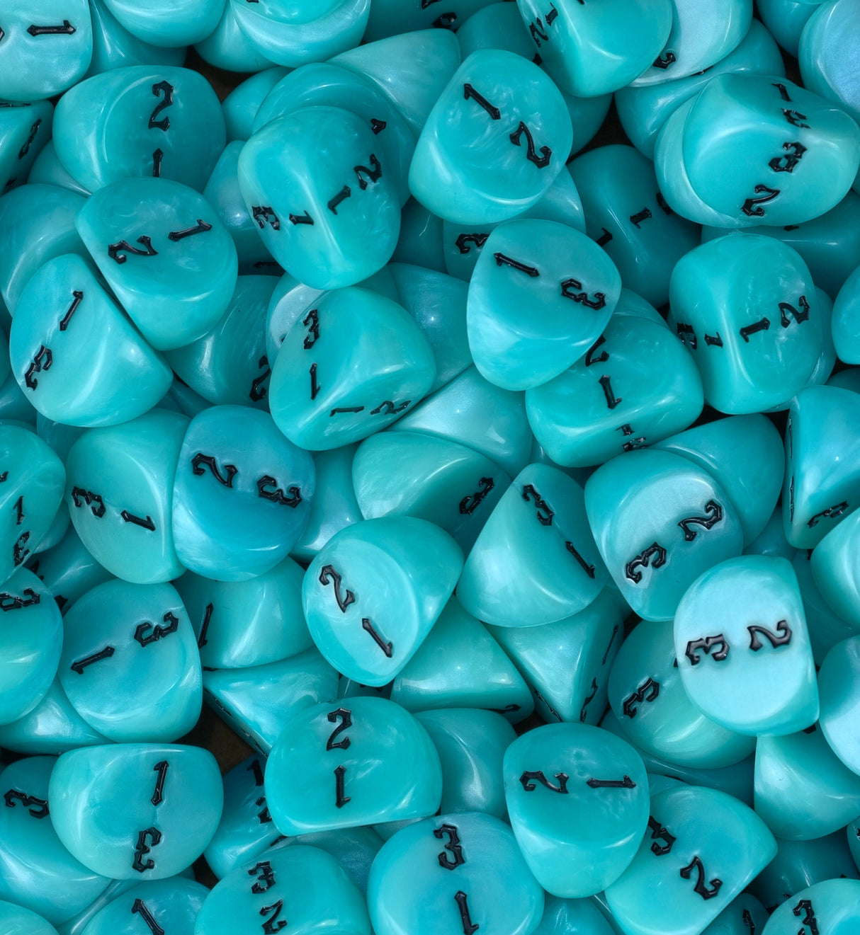 Turquoise D3 dice filling a tray from side to side for tabletop games