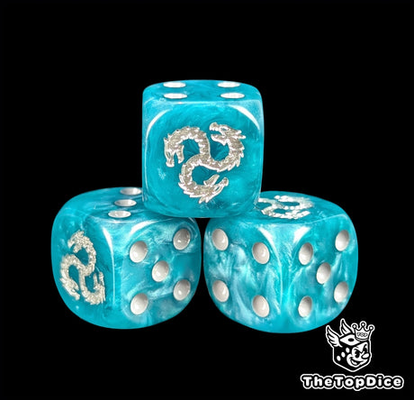 Close up of a turquoise 16mm resin D6 die engraved with a silver three headed hydra in a circle