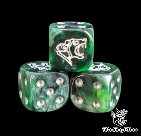 Close-up of a black and green ratfolk D6 die with a white rat face